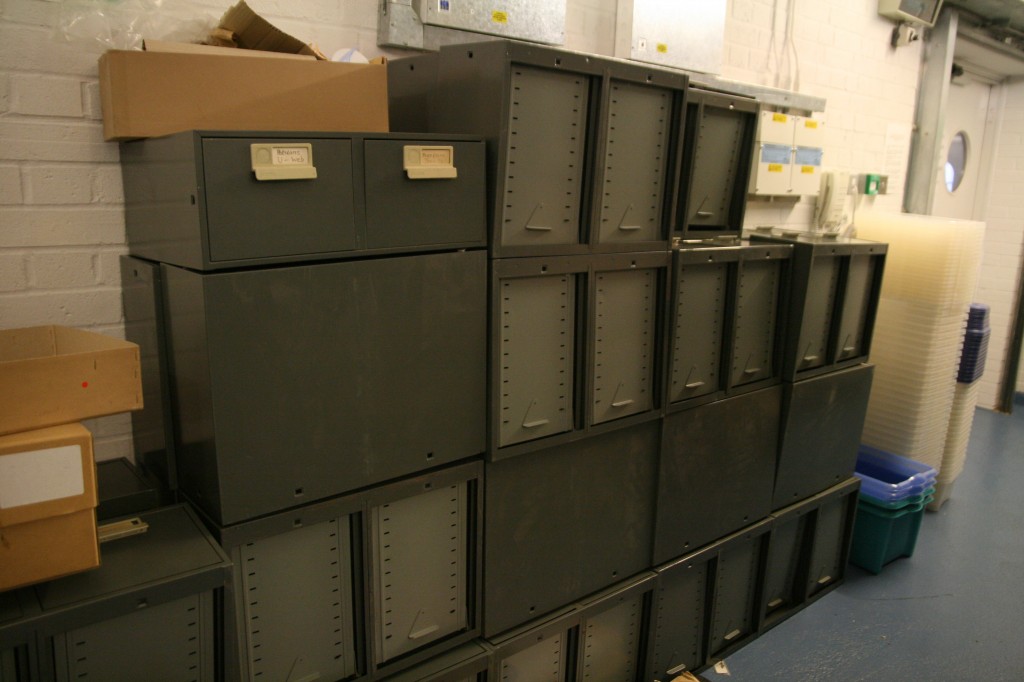 Some outgoing old storage containers, replaced with specialist archival materials