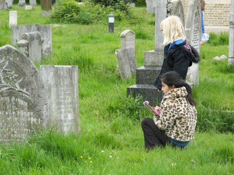 Students from Westborough Primary School searching the gravestones for people's stories
