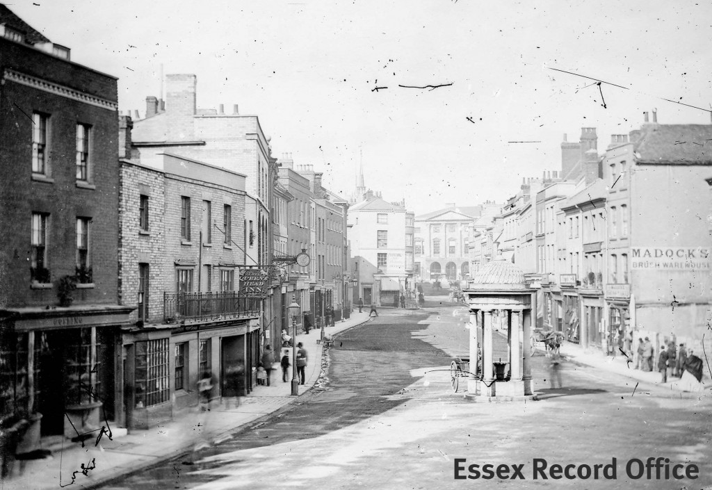 One of Spalding’s earliest photographs of the High Street c.1869. The Queen’s Head can be seen on the left.