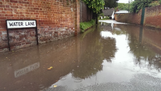 Photograph of large puddle on Water Lane