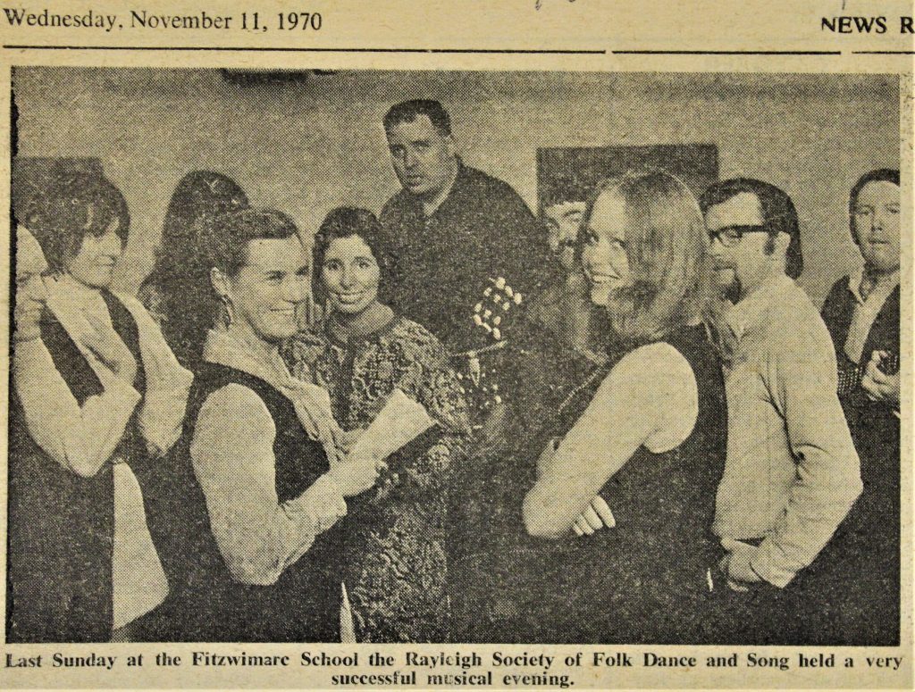 Newspaper cutting dated Wednesday, November 11, 1970, showing a photograph of a group of people gathered around a guitar. The photograph is captioned 'Last Sunday at the Fitzwimare School the Rayleigh Society of Folk Dance and Song held a very successful musical evening."